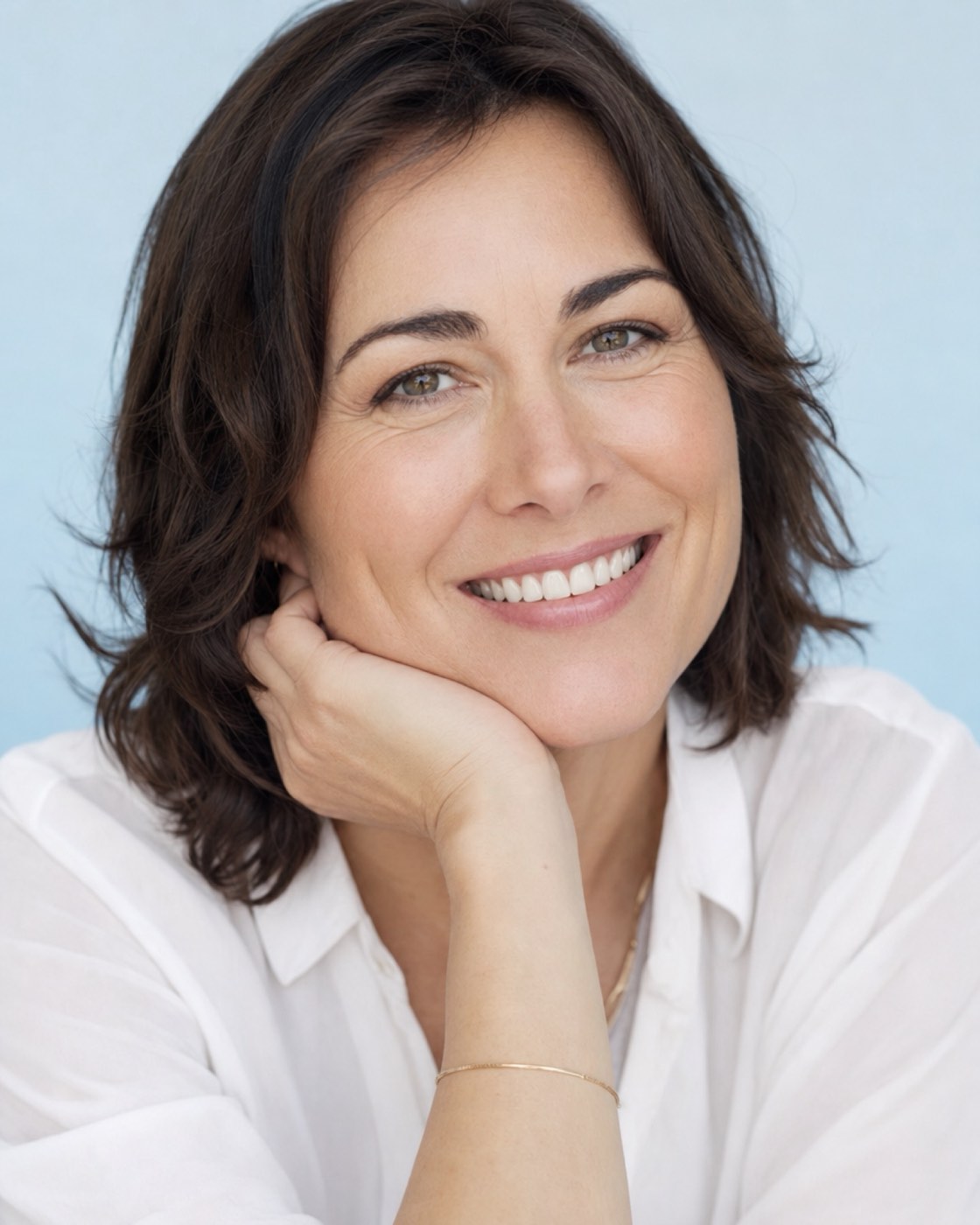 A woman with a warm, confident smile